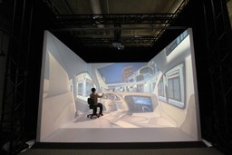 User experiencing the sense of driving a vehicle in the imseCAVE